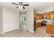 Open concept kitchen featuring stainless appliances and light wood cabinets, connecting to dining area at 820 Newcombe Rd, Raleigh, NC 27610