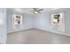 A serene bedroom with two large windows and neutral walls allowing for customization at 916 Clayton Rd, Durham, NC 27703