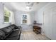 Cozy bedroom with hardwood-style flooring, a comfortable couch, and lots of natural light at 916 Clayton Rd, Durham, NC 27703