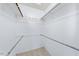 A walk-in closet featuring rods, hooks, and shelving for ample storage space at 916 Clayton Rd, Durham, NC 27703