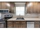 Kitchen sink with stainless steel appliances, ample counter space, and stylish cabinetry at 916 Clayton Rd, Durham, NC 27703