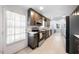 Beautiful kitchen featuring stainless steel appliances and door with natural light at 916 Clayton Rd, Durham, NC 27703