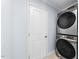 Efficient laundry area featuring modern stacked washer and dryer units at 916 Clayton Rd, Durham, NC 27703