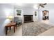 Cozy living room with a classic brick fireplace, neutral paint, and natural light at 916 Clayton Rd, Durham, NC 27703