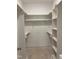 Walk-in closet featuring built in shelving at 977 Lewis Rd, Zebulon, NC 27597