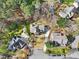 Aerial view of the home situated on a tree-lined street in a quiet neighborhood at 102 Stagville Ct, Cary, NC 27519