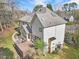 A spacious backyard view showcases a wooden deck and a sunroom extension at 102 Stagville Ct, Cary, NC 27519