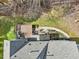 Backyard view featuring a wooden deck, patio, and landscaped area at 102 Stagville Ct, Cary, NC 27519