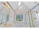 Bright bathroom boasts double sinks, a bathtub with jets, and a separate shower at 102 Stagville Ct, Cary, NC 27519