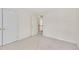 Neutral colored bedroom with a window and two doors at 102 Stagville Ct, Cary, NC 27519