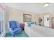 Bright bedroom with one window, painted art, traditional furnishings, and a plush armchair at 102 Stagville Ct, Cary, NC 27519