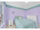 Bedroom with lilac walls, window, and plush carpeting at 102 Stagville Ct, Cary, NC 27519