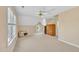 Large bonus room with carpet, windows, a ceiling fan, and closet at 102 Stagville Ct, Cary, NC 27519