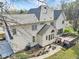 A beautiful home exterior featuring a deck, patio, and well-maintained landscaping at 102 Stagville Ct, Cary, NC 27519