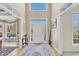 Spacious foyer with a two story ceiling, white trim and a gorgeous entry rug at 102 Stagville Ct, Cary, NC 27519