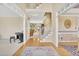 Open foyer with hardwood flooring and staircase leading to the second floor at 102 Stagville Ct, Cary, NC 27519