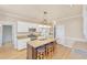 Bright kitchen with granite countertops, stainless steel appliances and center island with seating at 102 Stagville Ct, Cary, NC 27519