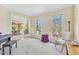 Living room with hardwood floors, bright windows, and lovely views of the outdoors at 102 Stagville Ct, Cary, NC 27519