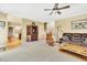 Spacious living room featuring a ceiling fan and hardwood floors throughout at 102 Stagville Ct, Cary, NC 27519
