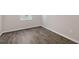 Bright room featuring new flooring, a light-filled window and neutral paint at 105 Pisgah St, Sanford, NC 27330