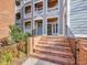 Brick steps lead to condo entrances, showcasing the building's access points and layout at 1051 Wirewood Dr # 202, Raleigh, NC 27605