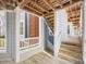 Exterior view featuring a wooden deck, stairs, and walkways with architectural details at 1051 Wirewood Dr # 202, Raleigh, NC 27605