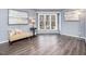 Cozy sitting area with hardwood floors, a large window, and comfortable seating at 1051 Wirewood Dr # 202, Raleigh, NC 27605