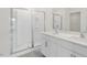 Bathroom featuring double sinks, modern vanity and glass shower at 108 Pisgah St, Sanford, NC 27330