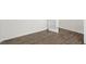 Bright bedroom showcasing wood-look flooring, white trim, white walls, and a stylish, glass paneled door at 108 Pisgah St, Sanford, NC 27330