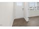 Inviting entryway featuring wood-look flooring, a white front door with glass, and plenty of natural light at 108 Pisgah St, Sanford, NC 27330