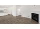 Spacious living room with wood-look flooring, a modern fireplace, and an open layout for comfortable living at 108 Pisgah St, Sanford, NC 27330