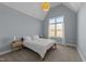Bedroom with neutral walls, carpet, and a large window at 110 Black Swan Dr, Youngsville, NC 27596