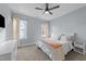 Cozy bedroom with carpet, two windows, and a ceiling fan at 110 Black Swan Dr, Youngsville, NC 27596