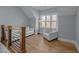 Bonus room with hardwood floors, sofa, and chair at 110 Black Swan Dr, Youngsville, NC 27596