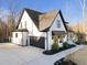 Stunning modern farmhouse featuring an attached garage and manicured landscaping at 110 Black Swan Dr, Youngsville, NC 27596
