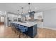 Modern kitchen with a large center island, stainless steel appliances, and sleek cabinetry at 110 Black Swan Dr, Youngsville, NC 27596