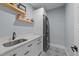 Well-organized laundry room with modern appliances and ample counter space at 110 Black Swan Dr, Youngsville, NC 27596