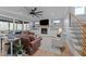 Living room with a fireplace, built-ins, a ceiling fan, and comfortable seating at 110 Black Swan Dr, Youngsville, NC 27596