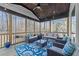 Screened porch with comfortable seating and wooded views at 110 Black Swan Dr, Youngsville, NC 27596