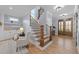 Staircase with wood steps, a black metal railing, and natural light at 110 Black Swan Dr, Youngsville, NC 27596