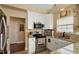 Well-lit kitchen featuring granite countertops, stainless steel appliances, and tiled backsplash at 1104 Garnet Ridge Way, Raleigh, NC 27607
