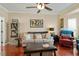 Bright living room with hardwood floors, neutral walls, plush seating, and elegant decor at 1104 Garnet Ridge Way, Raleigh, NC 27607