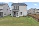 Home exterior features a screened porch, fenced yard, and green lawn at 1131 Pate Farm Ln, Durham, NC 27703
