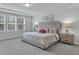 Bright bedroom featuring neutral decor, a large window, and plush carpeting at 1131 Pate Farm Ln, Durham, NC 27703