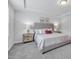 Bright bedroom featuring neutral decor, a large window, and plush carpeting at 1131 Pate Farm Ln, Durham, NC 27703