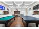 Community game room featuring a pool table, ping pong, kitchenette, and stylish decor at 1131 Pate Farm Ln, Durham, NC 27703