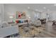 Spacious living room with neutral tones, stylish decor, and an adjacent dining area at 1131 Pate Farm Ln, Durham, NC 27703