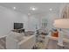 Cozy living room with a TV, comfortable seating, and access to the outdoor space at 1131 Pate Farm Ln, Durham, NC 27703