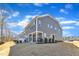 Charming home with gray siding, bright windows, and cozy covered back porch at 1160 Craigmeade Dr, Morrisville, NC 27560