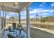 Cozy, covered patio with outdoor seating and view of green space and pond at 1160 Craigmeade Dr, Morrisville, NC 27560